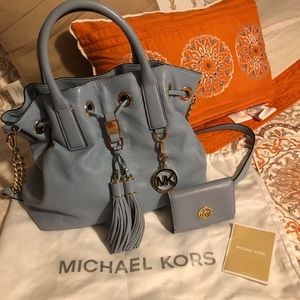 Michael Kors leather handbag and matching wallet.